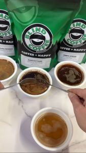 Coffee Cupping example showing how to remove the foam with 2 spoons